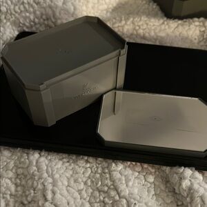 Swarovski crystal riser. Plastic with mirrored, removable top. Stackable.